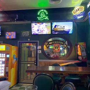 a bar with neon signs