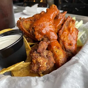 Mild chicken wings (chips and celery underneath)