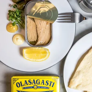 a plate of food and a can of olives