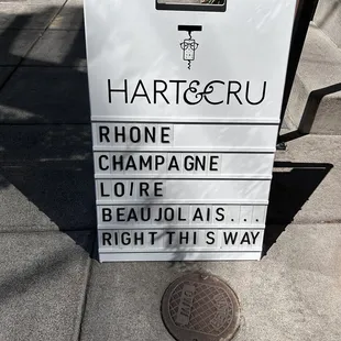 a sign on a sidewalk