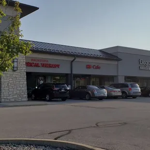 a parking lot with cars parked in front