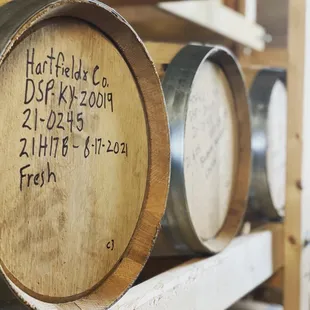 a row of barrels with labels on them