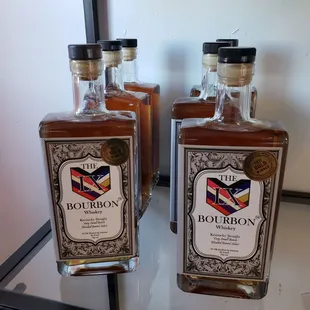 two bottles of bourbon on a table