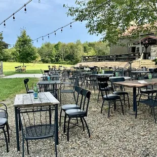 Ample outdoor seating with stage for live music.