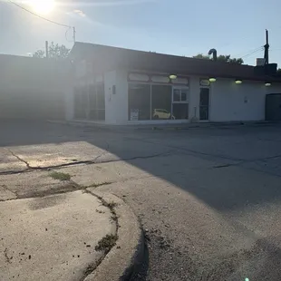 On the corner with the sun in yo face