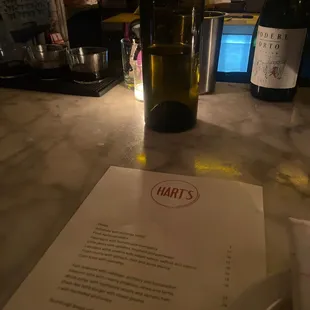 a menu and a bottle of wine