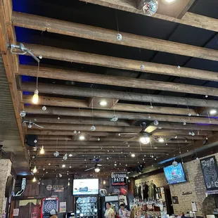How neat, multiple mini Disco Balls hanging from ceiling.  Nice looking bar.