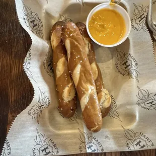 Pretzel sticks with dipping cheese.