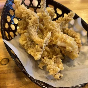 a close up of a basket of tempura