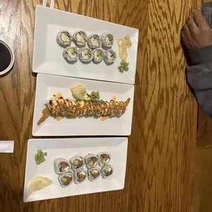 two plates of sushi and a cup of coffee