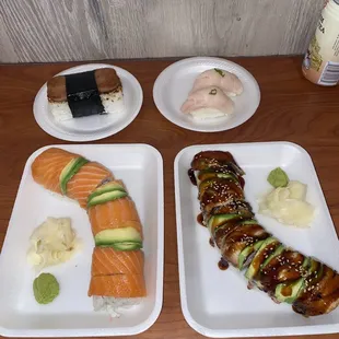Fresh made Spam Musubi,  fresh Yellowtail nigiri,  Salmon Rainbow roll, and Eel Dragon roll