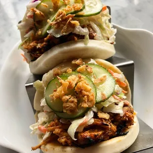 Pulled chicken bao bao bun with spicy aioli and onion chip!