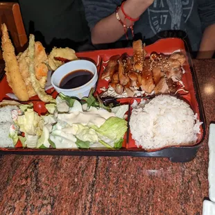 Chicken teriyaki bento box with California rolls. #2