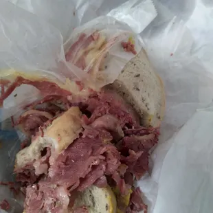 a corned beef sandwich in a wrapper