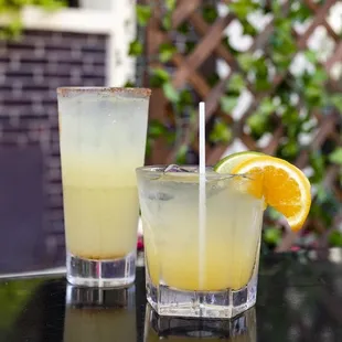 two glasses of lemonade on a table