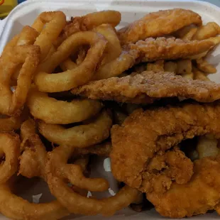 Chicken fingers with fries and onion rings