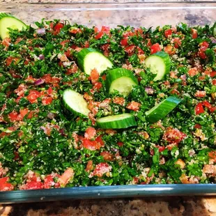 a glass dish filled with chopped vegetables