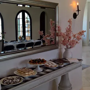 a table of pastries and desserts
