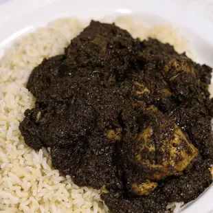 a plate of rice and meat