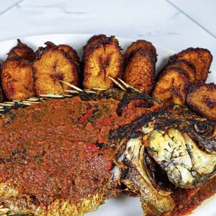 a plate of fish and potatoes