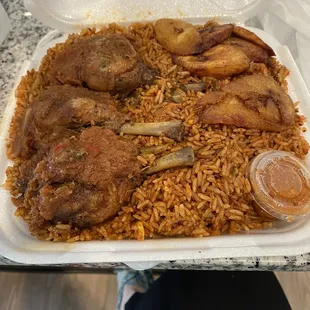 Large jollof rice with fried plantain and chicken