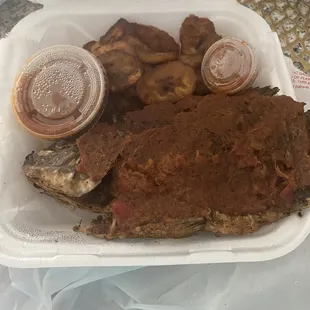 Whole tilapia and fried plantain