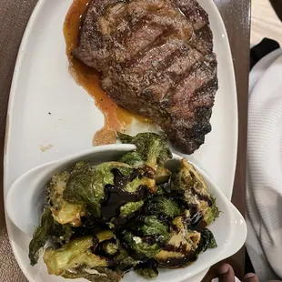 a plate of steak and broccoli