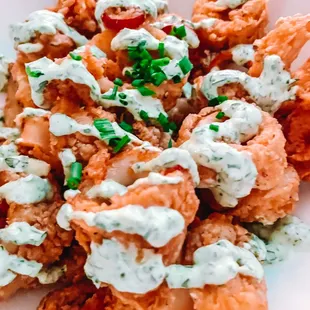 a plate of fried shrimp and vegetables