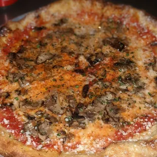 a pizza with mushrooms and cheese