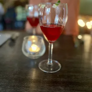 a glass of wine on a table