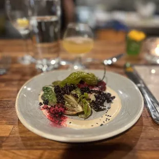 a plate of food on a wooden table