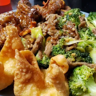 Orange Chicken and Szechuan beef with fried rice and Crab Rangoons. The Szechuan beef is marked spicy but has no spice to it whatsoever.