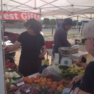 a group of people at a farmers market