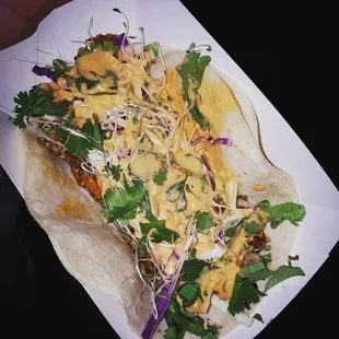 Sweet sweet potato with quinoa, cabbage, sprouts, cilantro, and vegan sriracha mayo. Can I buy 100? Holy yum!