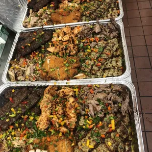 a variety of trays of food