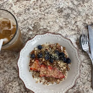 Oatmeal Grain bowel with an iced latte with oatmilk