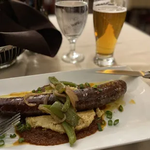 a plate of food and a glass of beer