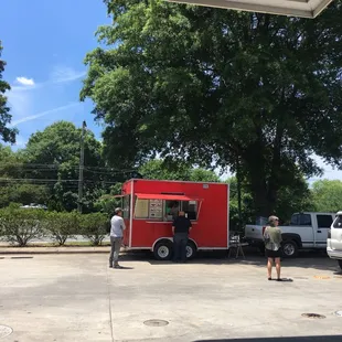 a food truck parked in a parking lot