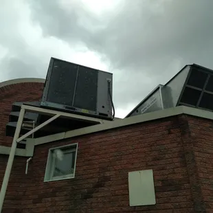 Sexy rear view of roof-mounted A/C units. It is so cold inside, you can hang MEAT!