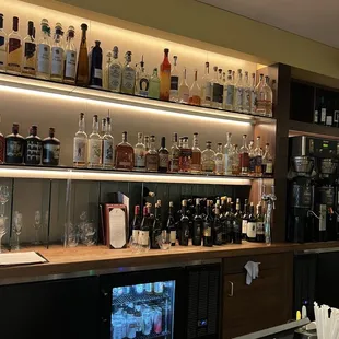 shelves of liquor bottles and glasses
