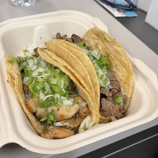 Pollo asada and carne asada tacos.