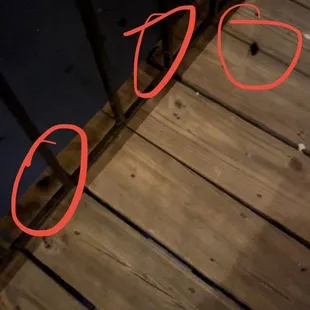 three red circles on a wooden table