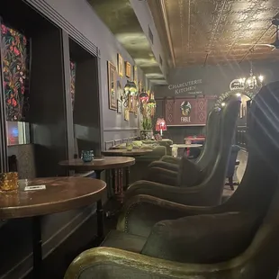 a row of green leather chairs
