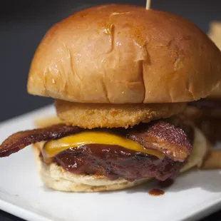 Our KC Southern burger is packed flavor from our housemade bbq sauce, creamy cheddar and smoky slab bacon. Not to mention that crispy onion