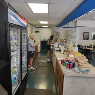 two people standing in a store