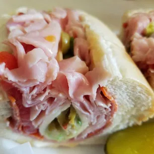 This is The Genoa Sub from Harvey&apos;s. Ham,  salami, pepperoni,  provolone, lettuce,  tomato,  green olives and Italian dressing.  Yummy!