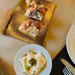complimentary focaccia and sour cream enhanced with tomato guts and pepper