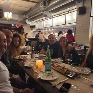 a group of people sitting at a table