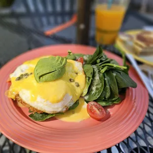 Eggs benedict, with a side of gluten-free pita, and a tasty beverage