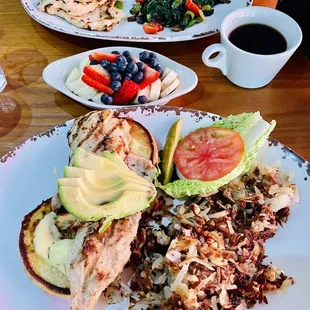 Grilled Chicken Breast and Avocado Sandwich, Fresh Fruit Bowl, Grilled Chicken Breast on a Plate